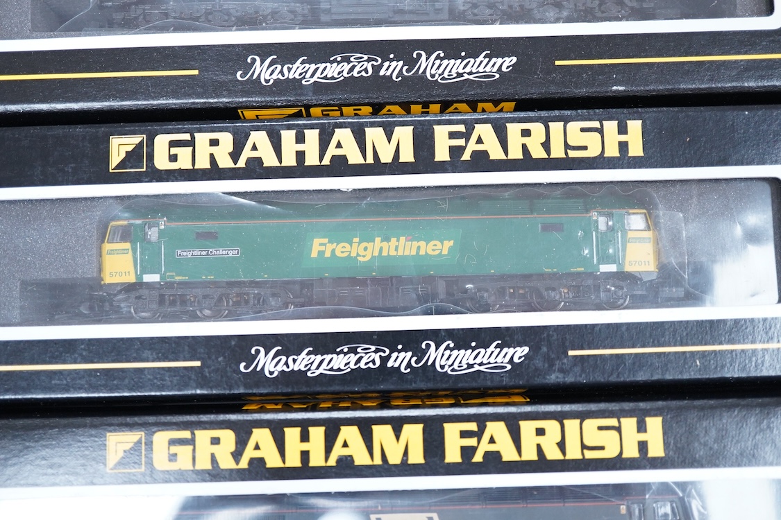 Three boxed Graham Farish N gauge railway diesel locomotives; an EWS class 56, 56105 (371300), a Load Haul class 56, Kellingley Colliery 56 074 (371301), and a Freightliner class 57, Freightliner Challenger 57011, (37122